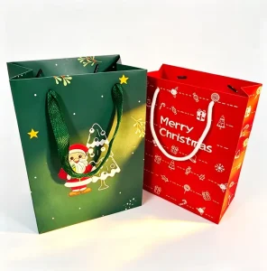 Custom Printed Christmas Paper Gift Bags Bulk Cartoon Santa Candy Tree Pattern Ribbon Handle Holiday Cookie Packaging