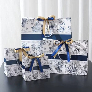 Luxury Floral Printed Eco friendly Recyclable Kraft Paper Gift Bag with Ribbon Bow Handle for Wedding Party Clothing Packaging
